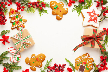 Wall Mural - christmas background with gingerbread cookies, gift boxes and branches of holly with red berries on 