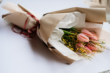 Bouquet of flowers in beige package