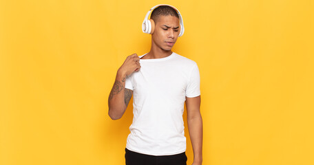 Wall Mural - young black man feeling stressed, anxious, tired and frustrated, pulling shirt neck, looking frustrated with problem