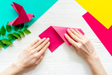 Wall Mural - DIY concept. Doing origami paper bird, Top view