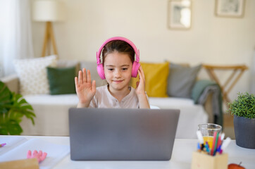 Wall Mural - Schoolgirl having online lesson indoors at home, coronavirus concept.