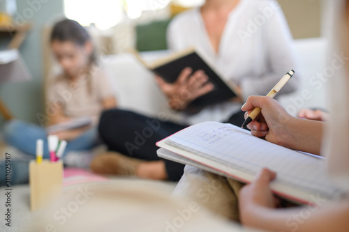 Fotomural Group of homeschooling children with teacher studying indoors, coronavirus concept