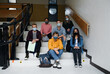 © Halfpoint - Front view of young students with face masks back at college or university, coronavirus concept.
