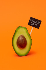 Poster - avocado fruit and text vegan day