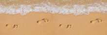 Texture Background Footprints Of Human Feet On The Sand Near The Water On The Beach
