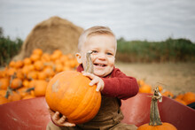 Lifestyle Of Happy Little Boy At A Pumpkin Patch