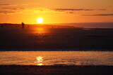 Fototapeta  - Glaring Red Sunset on the Beach of Juist. High quality photo