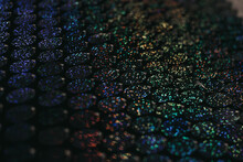 Sequins Close-up Macro. Abstract Background With Blue Sequins And Lilac Color On The Fabric. Texture Scales Of Round Sequins With Color Transition.