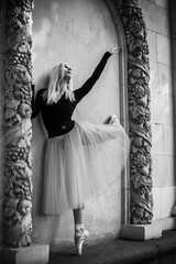 Wall Mural - Young ballerina in ballet costume dancing at darkness breath of freedom. Concept of beautiful art dancing 	
