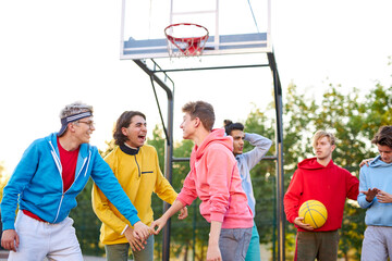 Wall Mural - cheerful team celebrate their winning in basketball game, shine with happiness. motivation, sport, basketball, youth concept