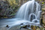 Fototapeta Krajobraz - Beautiful shot of Kamischlinskiy waterfall in Altai mountains in Siberia, Russia. Smooth, silky water. Long exposure