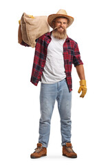 Poster - Full length portrait of a young bearded farmer carrying a sack on his shoulder