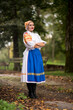 © muro - Slovak folklore. Girl in slovak folk dress.