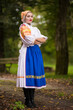© muro - Slovak folklore. Girl in slovak folk dress.