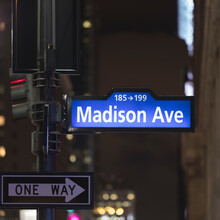 USA, New York, New York City, Madison Avenue Sign At Night