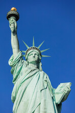 USA, New York, New York City, Statue Of Liberty Against Blue Sky