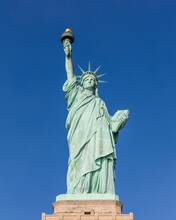 USA, New York, New York City, Statue Of Liberty Against Blue Sky