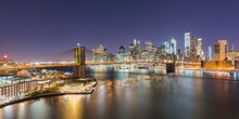 USA, New York, New York City, Brooklyn Bridge And Lower Manhattan Skyline Illuminated At Night