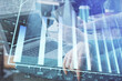 © peshkova - Double exposure of man and woman working together and forex chart hologram. Business concept. Computer background.