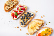 © ¬© Flavia Morlachetti/Westend61 - Studio shot of five slices of bread with fresh fruits