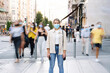 © Jose Luis CARRASCOSA/Westend61 - Young woman wearing mask standing on street in city
