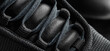 Black sneaker laces closeup. Stylish, minimalist and modern, casual shoe background.