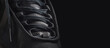 Black sneaker shoe on a black background. Closeup