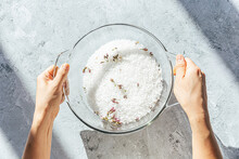 Hand Sifting Through Salt Preserved Cherry Blossoms