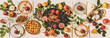 © sonyakamoz - Autumn Thanksgiving, Friendsgiving, family gathering dinner table setting. Flat-lay of Fall decorated table with roasted duck in seasonal fruits, vegetables, cheese board, apple pie and wineglasses