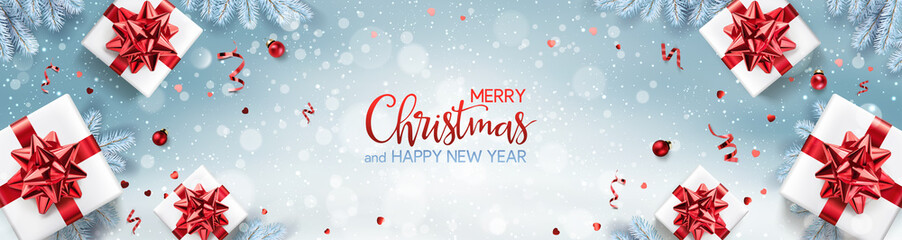 Wall Mural - red christmas and new year text on xmas background with gift boxes, fir branches, red ribbon, decora