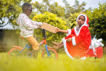 image of african kids, presenting a package- christmas concept