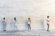 © GiuseppeElioCammarat - Young people standing in line to coronavirus pandemic safety