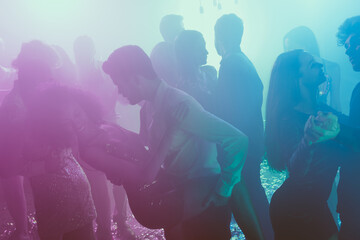 Poster - Photo of big group many people couple dance tender man hold girl leg neon bright spotlight modern club indoors