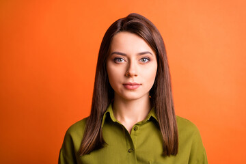 Poster - Photo of charming young business lady look camera clam face wear green shirt isolated orange color background