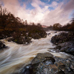 long exposure shot of the waterfalls in glen orchy near bridge of orchy in the argyll region of the highlands of scotland during autumn