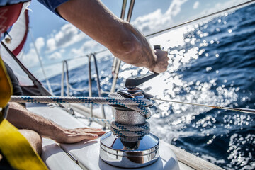 Rope hauling on the winch, on the yacht.