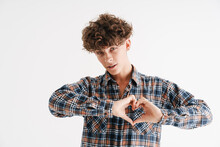 Young Curly Guy In Plaid Shirt Gesturing Heart Shape With Hands