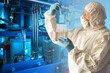 © Grispb - Chemist technologist in production. Concept - chemist takes samples at hazardous production. Pipes in background as a symbol of chemical industry. Man in a chemical protection suit with test tubes.