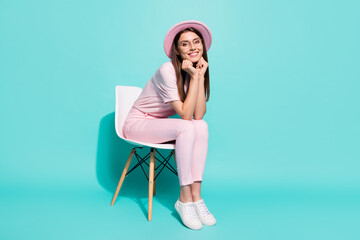 Wall Mural - Full size photo of pretty nice lady sitting on white chair isolated over teal color background