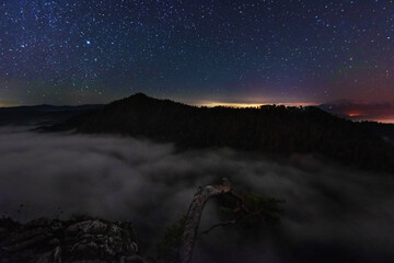 Wall Mural - starry nights in the high tatras with a tourist in a tent on top