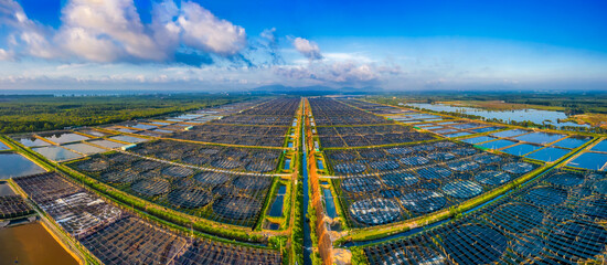 Aerial view of the High technology white shrimp ( prawn ) farm with aerator pump in front of Loc An, Ba Ria Vung Tau, Vietnam.