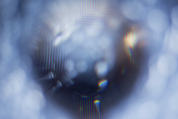 A real photo of an abstract blurry object. An abstract blurry silhouette of a round object.