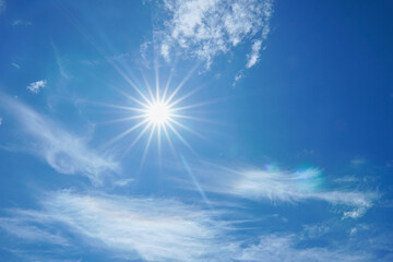 beautiful nature of blue sky with clouds and sun shines bright in the day