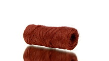 Skein Of Red Jute Twine Rotating On Isolated White Background. Natural Woolen Twine In Motion. Knitting Decor, Clothing Industry, Handmade Hobby, Recycled Eco-friendly Fashion Concept. Copy Space