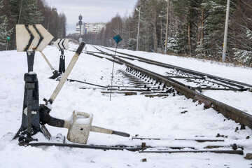 Wall Mural - Railway in winter. Snow-covered railway tracks.