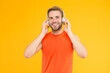 © be free - carefree student. male fitness fashion. man in headset listen song for training. sport and music. quality of sound. innovative wireless device. workout. sportsman guy with ear stereo headphones