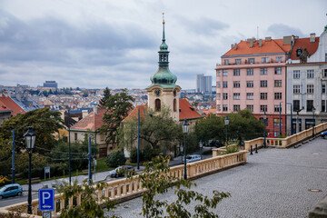 Vrsovice Square and baroque tower of the St. Nicholas Church during the autumn day, Prague, Czech Republic