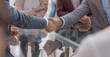 © ASDF - business people greet each other with a handshake