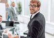 © ASDF - close up. successful young businessman standing in the office