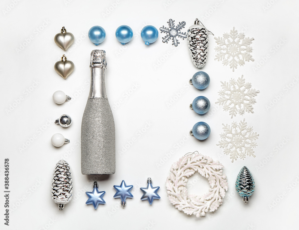 Christmas composition with bottle of champagne on white background